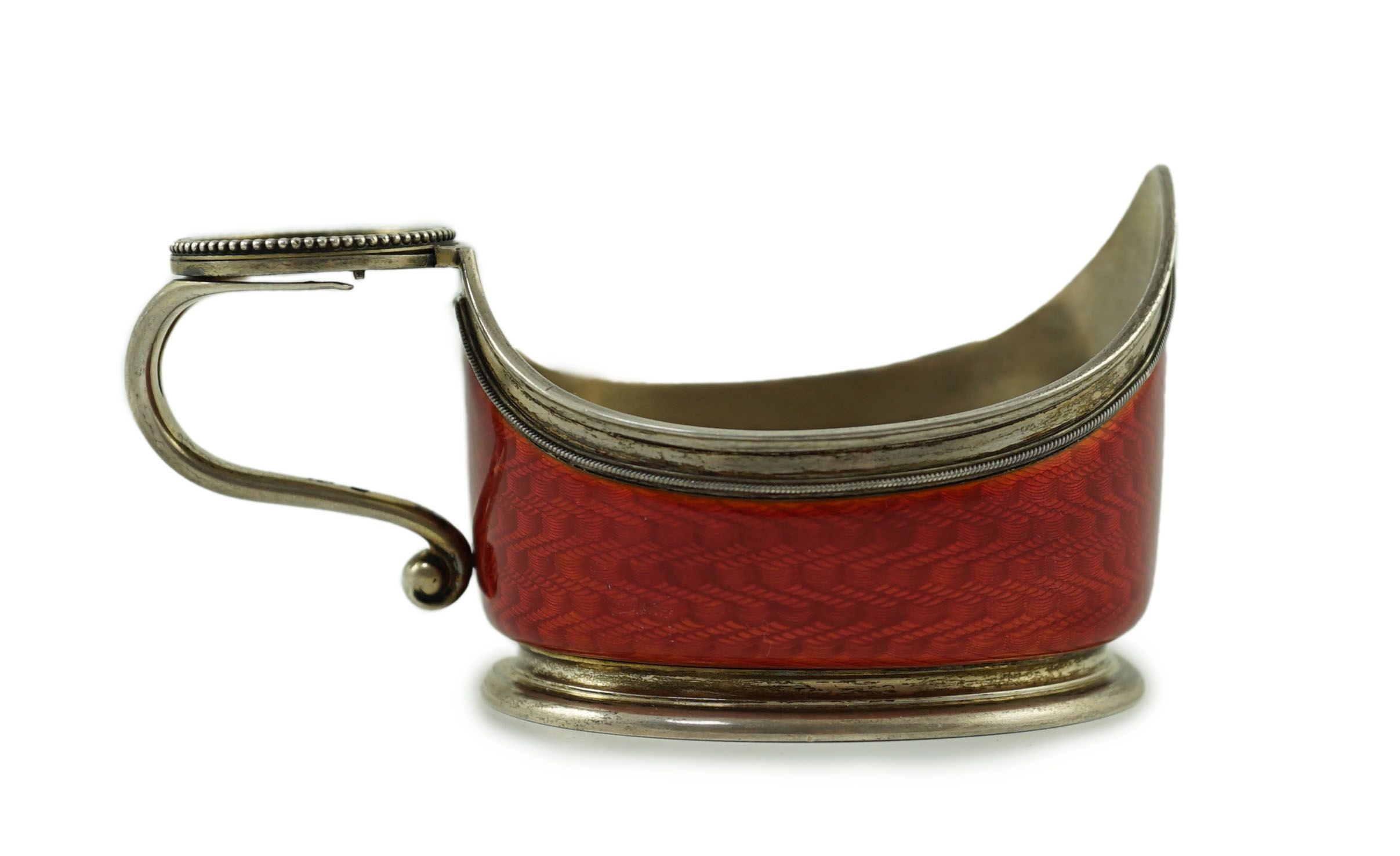CARL FABERGE: A late 19th/early 20th century 88 zolotnik and red guilloche enamel oval kovsh, work master Anders Johan Nevalainen